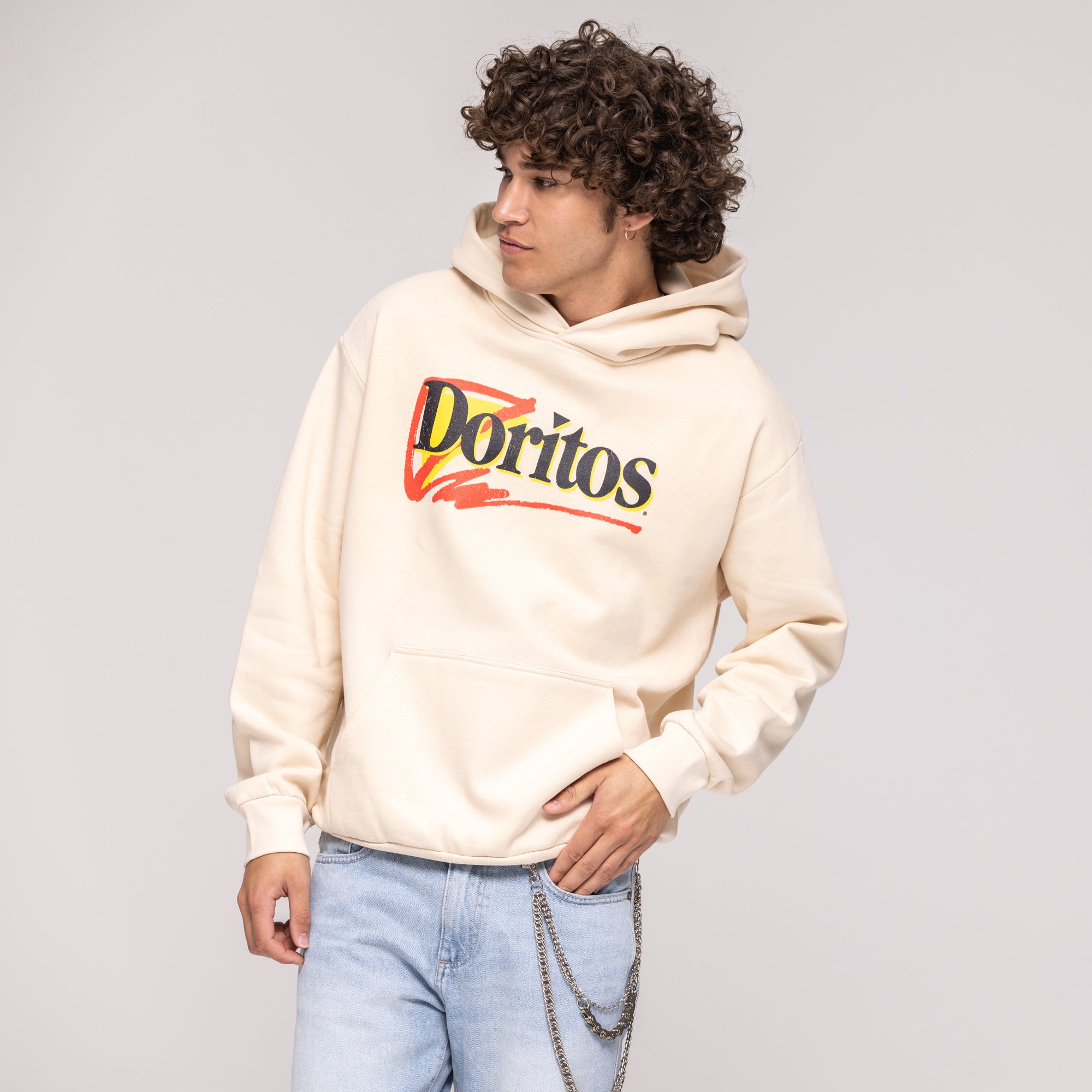 Cream pullover hoodie with red, yellow, and black 