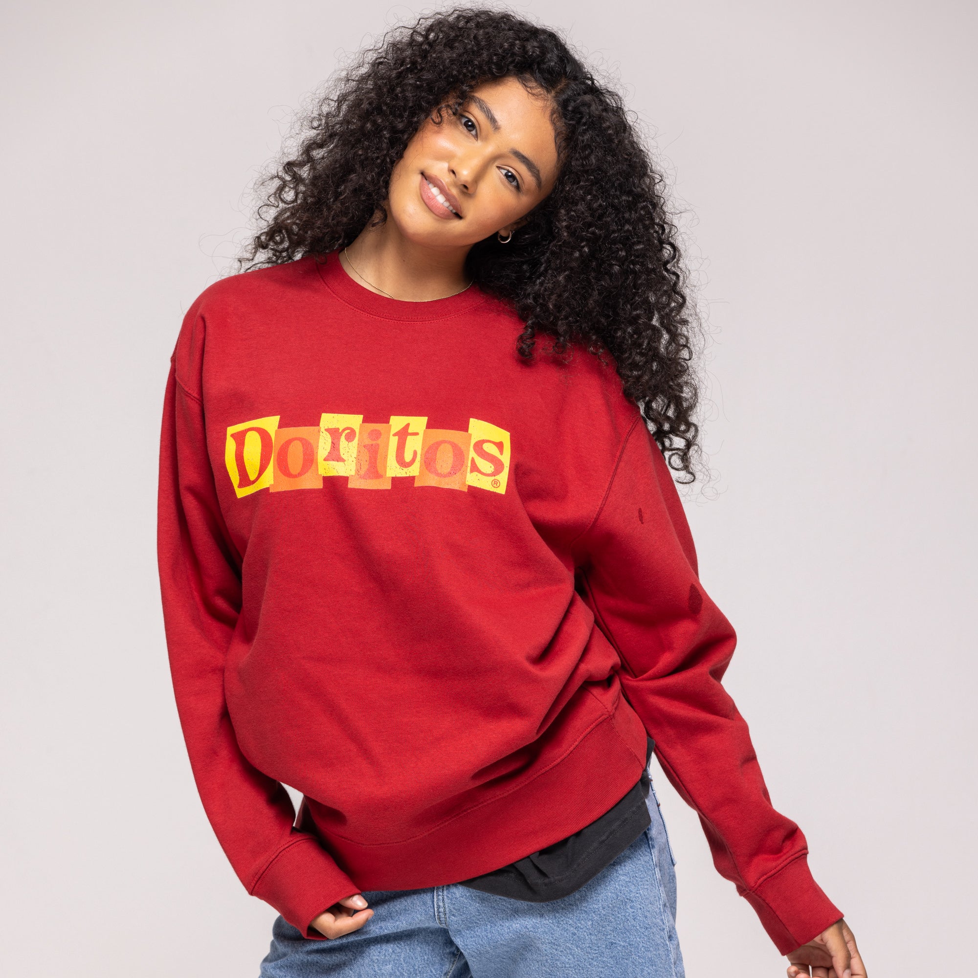 Red crewneck sweatshirt with yellow and orange 