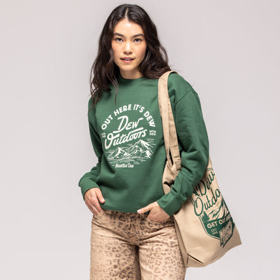 Green crewneck sweatshirt with white mountain scene graphic reading 