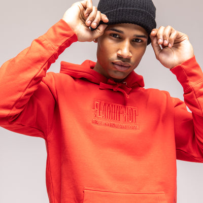 Close-up of a red hoodie with tonal embroidered 