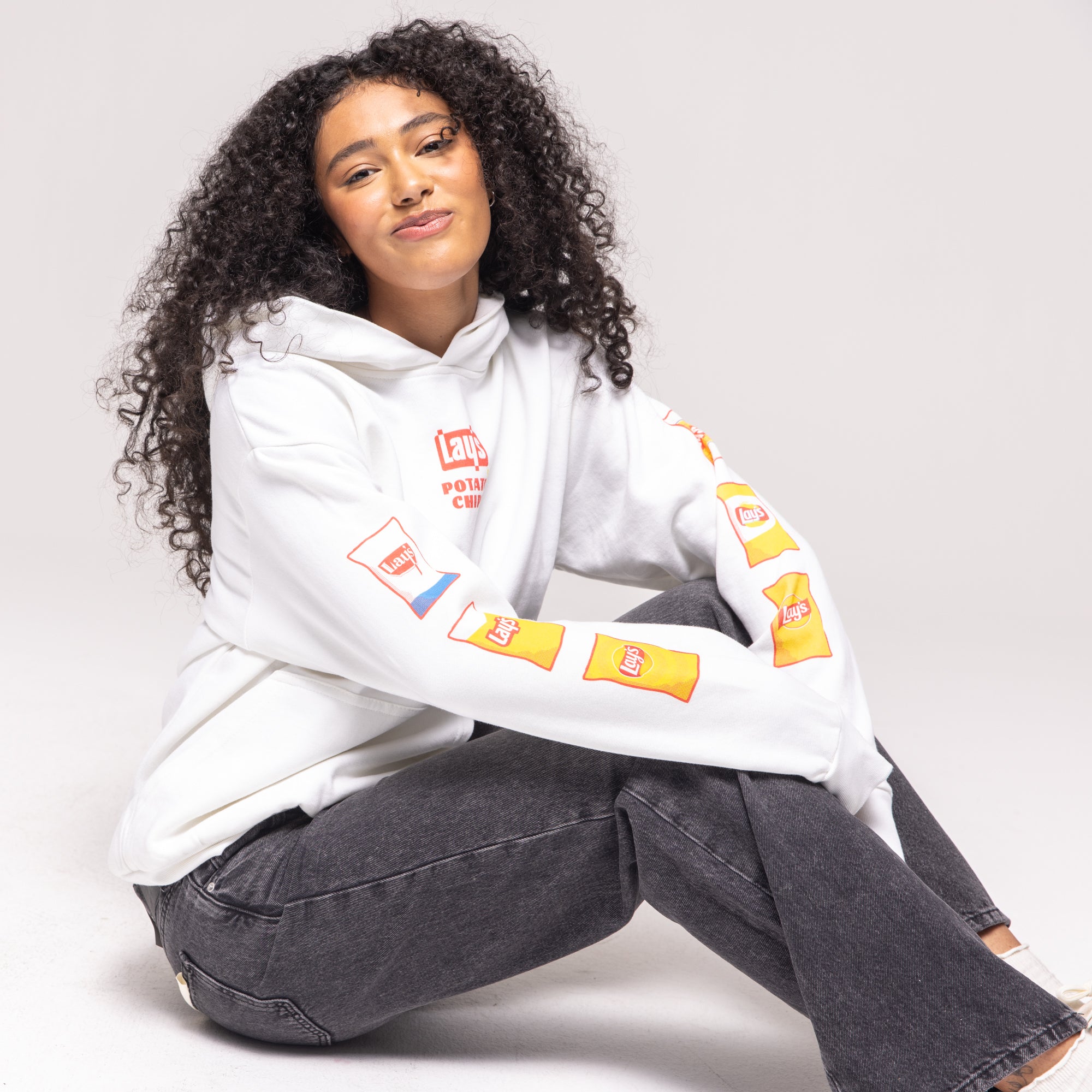 White hoodie with Lay's potato chip bag graphics on sleeves, 