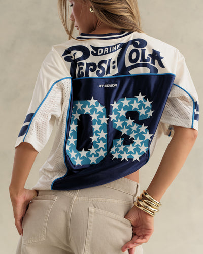 Back view of a model in the Pepsi V-neck jersey showing the starry OS print