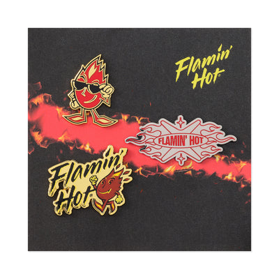Three Flamin' Hot enamel pins on a black and red flame card: Sparky mascot in sunglasses, silver 