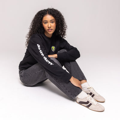 Black crewneck sweatshirt with green alien patch and white 