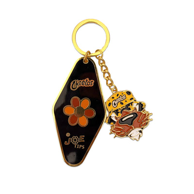 Cheetos X JaeTips key chain with hotel tag and Chester enamel charms